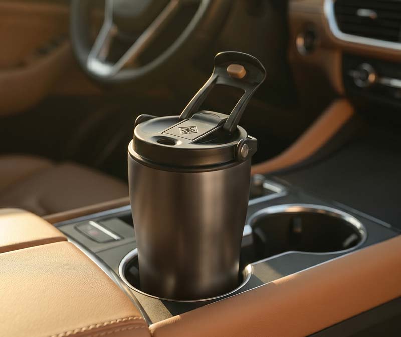 Holding a coffee tumbler in a car, cup-holder friendly base